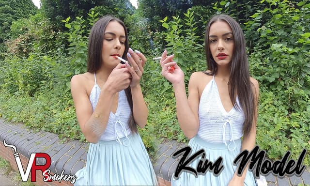 Kim Model wears a knitted top in a non POV solo fetish scene captured in 4K 60 FPS by VR Smokers.
