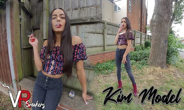 Kim Model poses outdoors in dark jeans during a solo non POV VR Smokers premium 60 FPS production